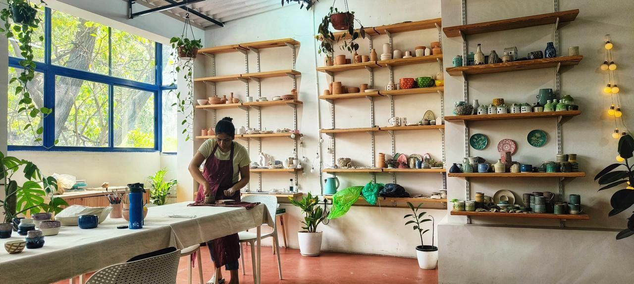 Mudcast Pottery Studio — students working with clay in Indiranagar