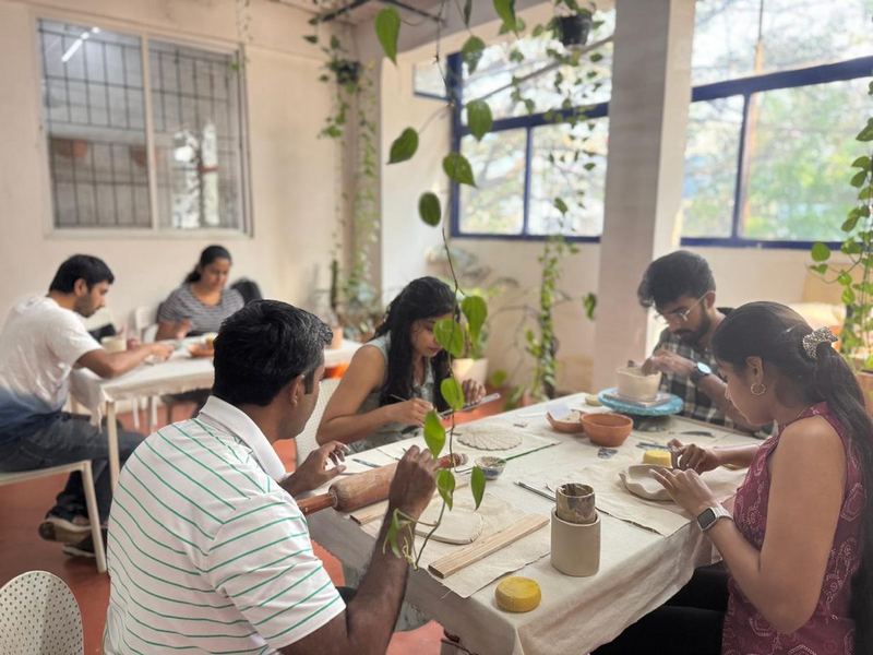 Hands on pottery wheel at Mudcast